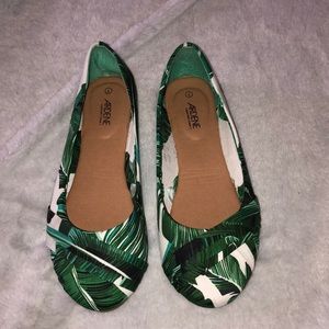 Green and white flats with a leaf pattern